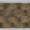 Dark brown layered simulated cork with silver colored frame